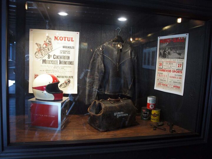 heroes motorcycles serge bueno s homage to history, Interior window display features original gear and posters from French motorcycling events including the 1930 Motorcycle Soccer competitions