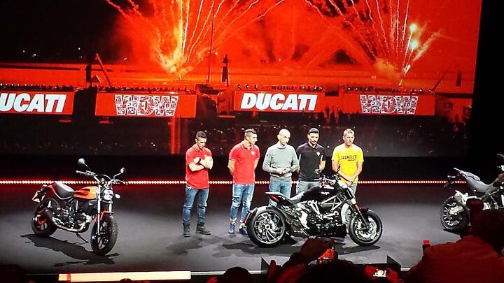 duke s den notes from walking miles of aisles at eicma, Claudio Domenicali center flanked by MotoGP riders Andrea Dovizioso and Andrea Iannone on left and Davide Guigliano and Troy Bayliss on right said Ducati exceeded 50 000 bikes sold by November 10 a new record for the Italian company and up 23 over 2014