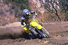 church of mo 2001 suzuki rm250, New suspension components and frame geometry help the RM rail rutted corners