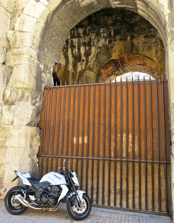 riding motorcycles in france how the french roll, New and old The sporty Kawasaki stands in contrast with the Roman style coliseum in Arles now an active bullfighting stadium