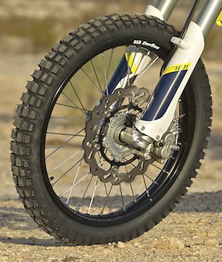 2016 husqvarna 701 enduro review, A 300mm floating wave rotor and Brembo two piston caliper provide plenty of stopping power and a linear feel at the lever Husqvarna has also fitted the braking system with a Bosch two channel ABS that can be deactivated at both wheels simultaneously in stock form or with an accessory dongle set up to keep the front ABS turned on but deactivate the rear ABS