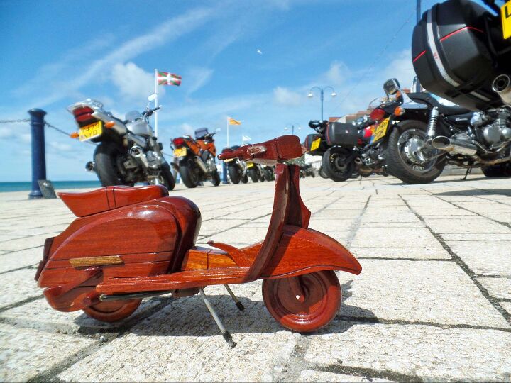 riding motorcycles in britain, Seaside villages and towns such as Aberystwyth pictured here encourage motorcyclists to park on the seafront promenade feeling the bikes presence adds to the atmosphere