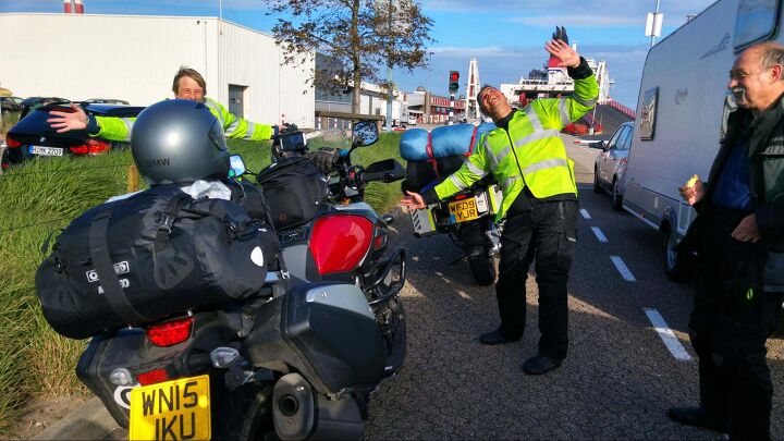 riding motorcycles in britain, I met these Brits waiting for a ferry across the English Channel I had been taking photos of the ship and they came running at me shouting Photo bomb