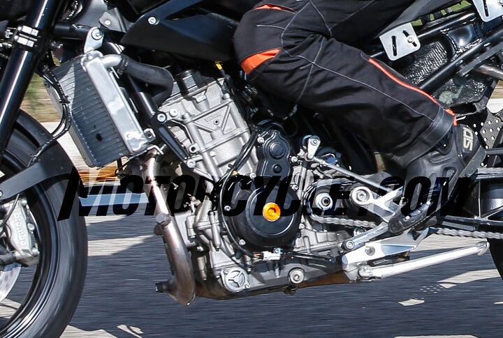 2017 ktm 890 duke spy shots, Check out how close the countershaft sprocket is to the crankshaft location indicated by the orange disc this engine is incredibly short front to rear