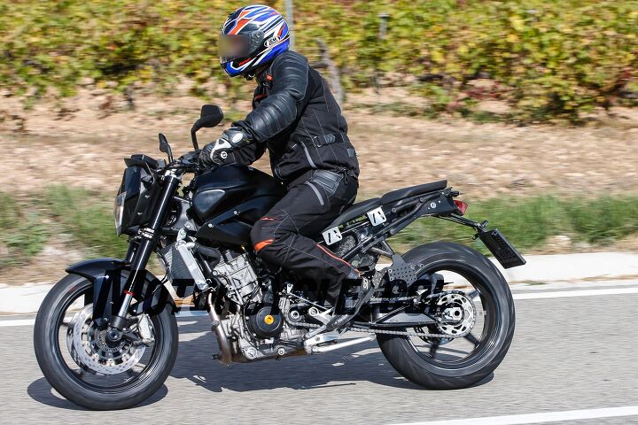2017 ktm 890 duke spy shots, The ergonomics look to be similar to other KTM Dukes with an upright riding position mixed with slightly rear set pegs Bracketry under the seat shows crude provisions for seat adjustments during development