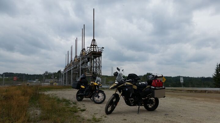 motorcycle adventures in northeastern ontario, Taking a break by the massive hydroelectric dam in Fraserdale