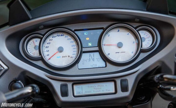 2016 victory magnum x 1 stealth edition review, The stereo s information screen is on the bottom Despite its diminutive size and dated monochrome layout it effectively delivers all the data the rider needs