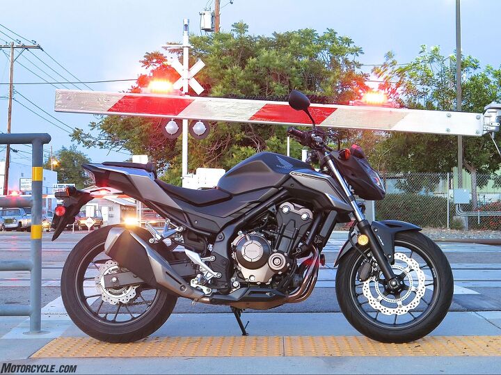 2016 honda cb500f abs review, Honda says the new exhaust gives better mass centralization and a crisper exhaust note It s still a super quiet non obnoxious little bike except when you honk the horn instead of the turnsignal button because they re reversed Why Photo by JB