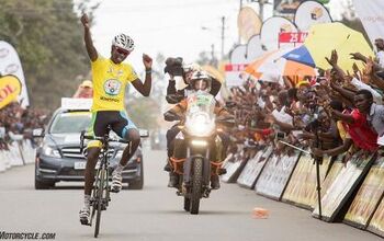 Riding Motorcycle Support in the Tour Du Rwanda Bicycle Race