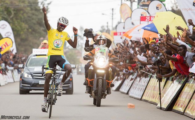 Riding Motorcycle Support in the Tour Du Rwanda Bicycle Race