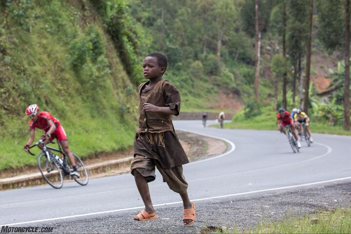 riding motorcycle support in the tour du rwanda bicycle race, Two decades ago 800 000 people died here Today a bicycle race offers pageantry excitement and hope Photo by Mjrka Boensch Bees