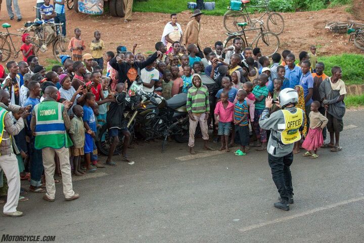 riding motorcycle support in the tour du rwanda bicycle race, I am taking pictures of them while they take pictures of me our cultures reverberating through the lenses Photo by Jock Boyer