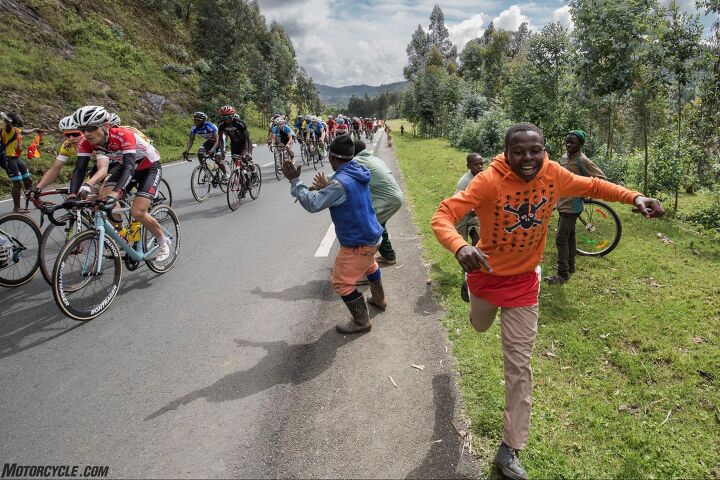 riding motorcycle support in the tour du rwanda bicycle race, All this will seem like a dream said my host And so it was Photo by Mjrka Boensch Bees
