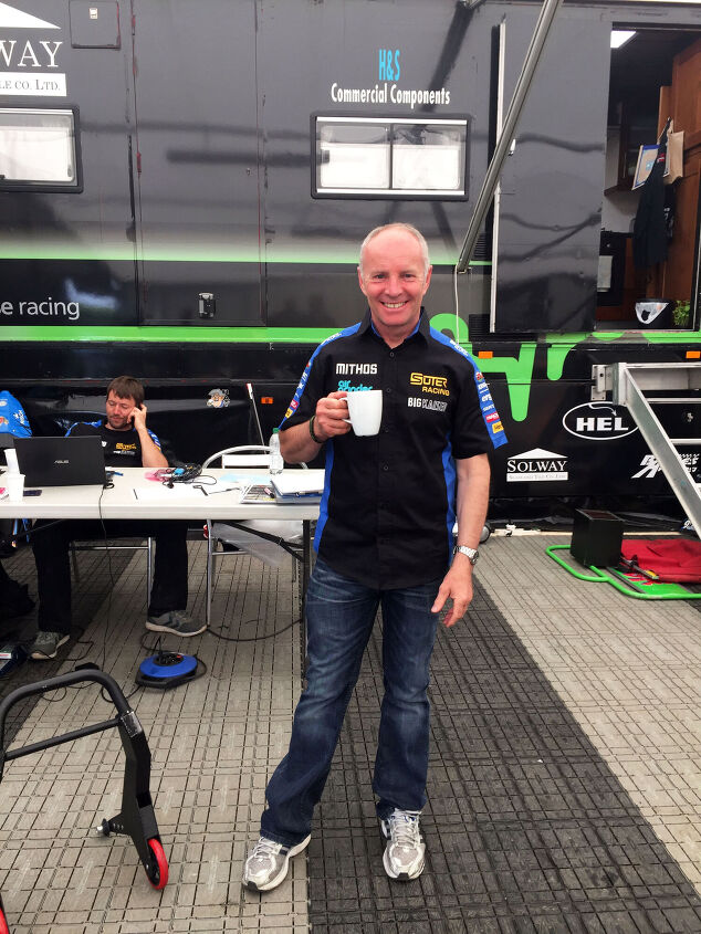paddock patter at the 2016 isle of man tt, Ian Lougher enjoys a warm brew before qualifying on the Suter MMX two stroke Photo by Andrew Capone