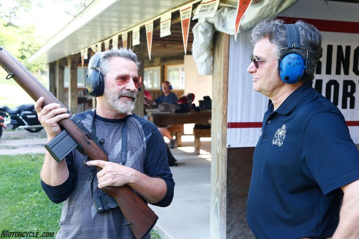 the american iron road tour, MO s beloved savant John Burns fondles one of Springfield s walnut stocked M1 A rifles prior to drawing a bead on a 100 yard target It was no problem for the eagle eyed graybeard