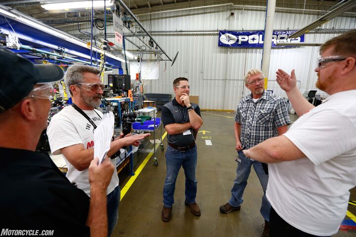 the american iron road tour, Polaris Industries Plant Manager Jesse Barthel middle took us on an extensive tour of Polaris Osceola Engine Assembly Plant introducing us to a lot of neat folks inside the place like Phil Wallander plaid shirt who built the very first Indian engine after Polaris bought the brand in 2009
