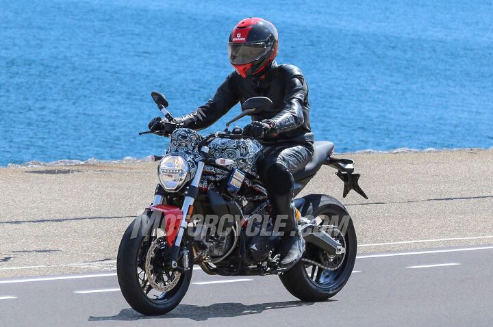 2017 ducati monster 800 spy shots, Also new is the headlight an evolution of the current Monster s headlamp with the addition of Euro 4 mandated daytime running lights in a strip of LEDs running across the lens