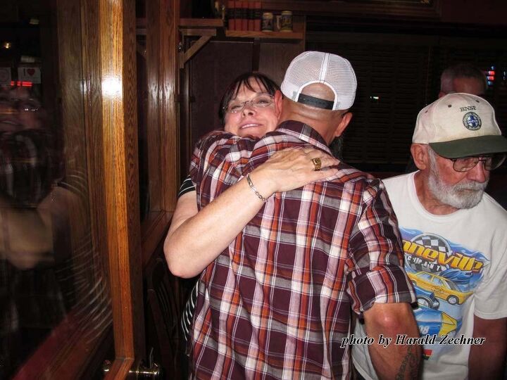 honoring sam wheeler a meeting of the board, Carol Wheeler gets a hug from racer Wes White Bonneville Tech Inspector Bruce Vaughan is in the white t shirt