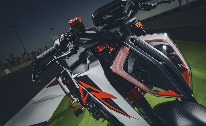 2017 ktm 1290 super duke r first ride review, The 2017 Super Duke R is obvious by way of its new headlight tank shrouds and lack of rear bodywork The headlight is fashionable as well as functional the split design allowing for airflow through the center to help cool the LED lights reflectors and light control units