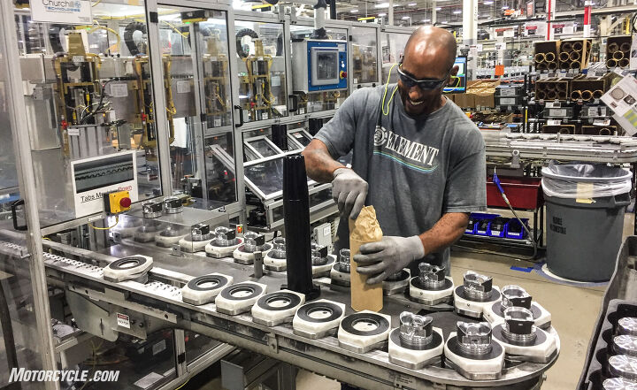 touring harley davidson s pilgrim road powertrain operations plant, Preparing pistons for one of the automated processes