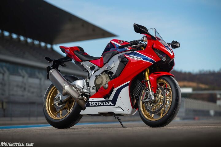 2017 honda cbr1000rr and cbr1000rr sp review, About the only exotic materials you can see in this picture of the SP are the titanium exhaust canister and magnesium crankcase cover But the quest for weight savings go far greater Don t forget the titanium fuel tank steel on the standard model aluminum subframe which granted is partially visible hollow transmission shafts and even thinner fairings compared to the old bike