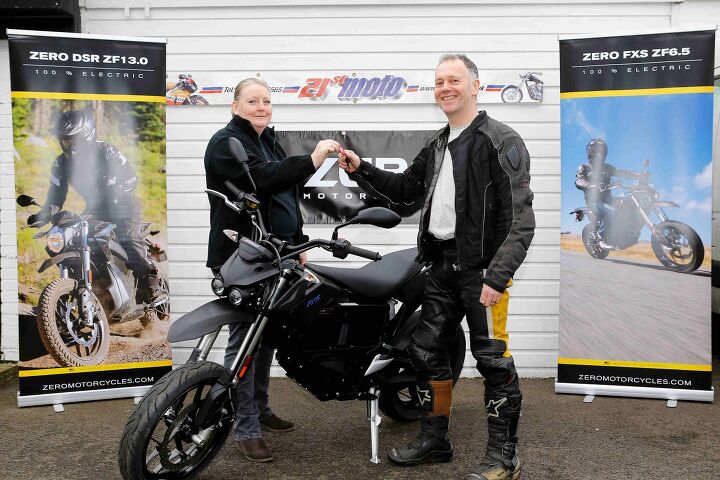 uk s plug in grant benefits its first customer, Collecting the U K s first electric bike to be sold with an OLEV plug in grant for e motorcycles Fred Murphy from Redhill Surrey collects his bike from the staff at 21st Moto