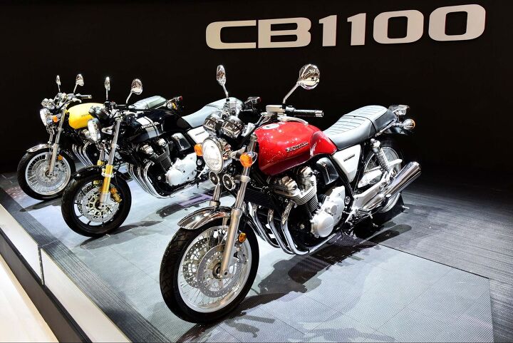 would you buy a 2018 cb1100 rs, The CB1100 RS in black is sandwiched between two EXs The red bike in the foreground is an EX identical to the one we re currently testing
