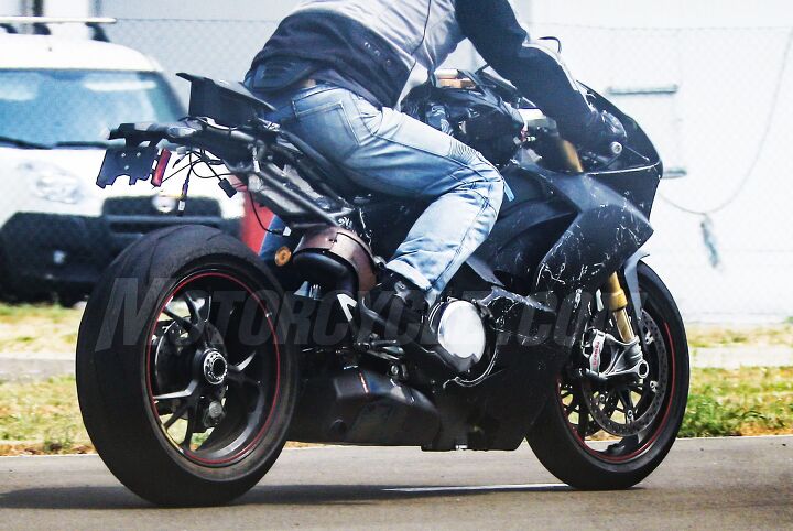 2018 ducati v 4 superbike spy shots, Note the snaking header pipes from the two rear cylinders that dump into a sizable muffler under the engine a la the Panigale and Buell EBR A single sided swingarm like the Panigale carries over The cobby heat shielding and unfinished tailsection reveal this test mule is still several steps away from production