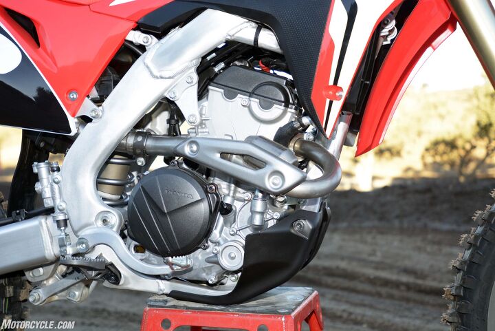 2018 honda crf250r first ride review, A larger bore and shorter stroke help to give the Honda s 249 5cc four single a rev ceiling of 14 400 rpm 900 revs more than the Unicam engine it replaces Like the dual cams the dual exhaust port cylinder head is a first for the CRF250R