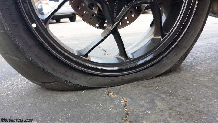 what to do if your motorcycle breaks down on the highway, Getting a flat tire can mess up your day but not being careful on the side of a busy interstate can make the situation much worse
