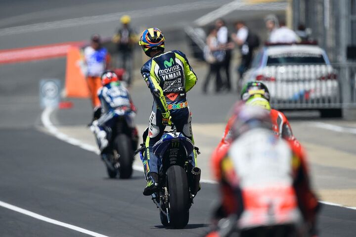 us motorcyclists and our weird superstitions, Valentino Rossi has many pre ride rituals Perhaps his most commonly known is when crouches besides his bike always on the right hand side holds the foot peg and bows his head See lead photo The second most common is while leaving pit lane where he stands on his pegs and adjusts himself both front and rear