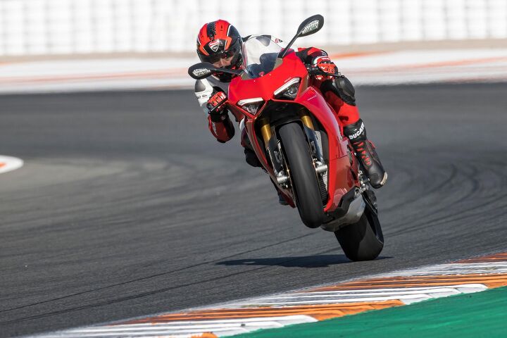2018 ducati panigale v4 first ride review 10 things you need to know, Valia tearing around the track enjoying the grip from a taller and improved 200 60 17 Pirelli Supercorsa SP and Ducati Wheelie Control EVO with higher precision to allow wheelies with less abrupt intervention Loft heights near this are available in DWC 3 which proved to be slightly quicker around the track than DWC 2 that sometimes required closing the throttle to keep the front tire down and steering
