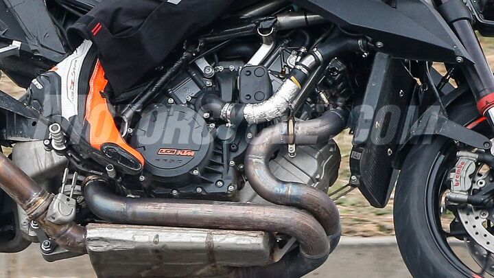 2019 ktm super duke r spy photos, The winding exhaust is the most striking difference on the test mule Tightened emissions requirements are to blame for that gigantic catalyst though we expect the finished product to be more refined KTM also likely won t leave the exhaust valve under the rider s foot moving it somewhere less conspicuous