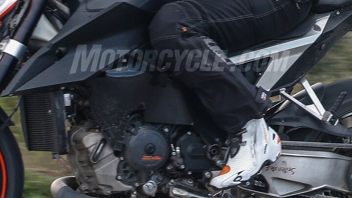 2019 ktm super duke r spy photos, While we can clearly see the right side of the engine the left side is obscured by some bodywork The bottom edge of the plastic looks crudely cut and it may be only temporary to hide some details from spies