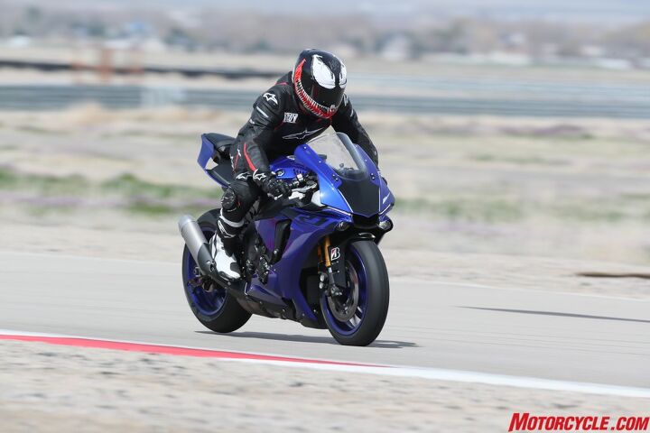 climbing the yamaha r world ladder, The YZF R1 is all business Twist the throttle carve apexes or skim the rear slightly above ground that s when the R1 feels alive