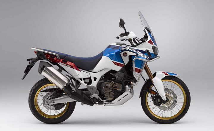 2018 honda africa twin adventure sports first ride review, The finish of the entire Africa Twin Adventure Sports exudes quality from the 30th Anniversary paint scheme to the anodized rims and handlebar Shown above is the DCT model evident by the extra dual clutch transmission bits on the right side of the motor