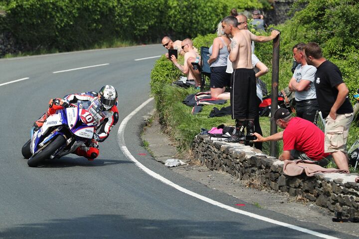 out and about at the isle of man tt 2018 part one, Peter Hickman BMW Smiths Racing BMW approaching The Gooseneck during the RL360 Superstock TT Race With some daring and underdressed spectators Photo by Dave Kneen Pacemaker Press