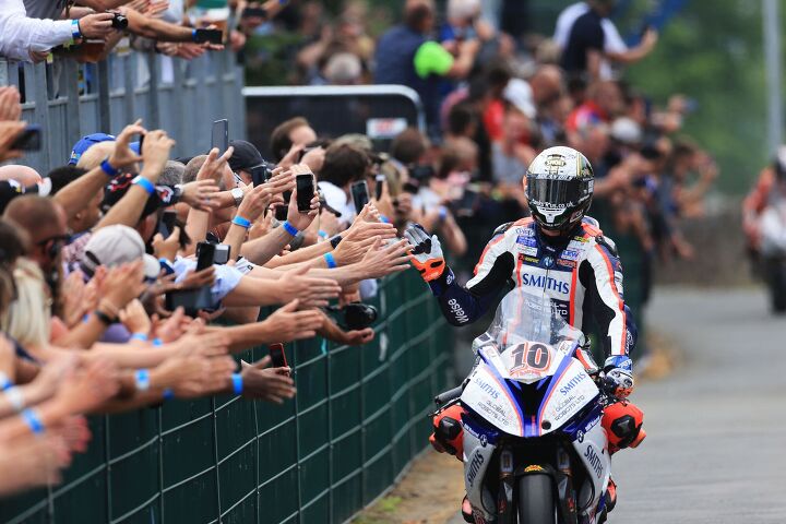 out and about at the isle of man tt 2018 pt 2, Peter Hickman high fiving spectators after winning the 6 lap 226 mile long PokerStars Senior TT Credit IOMTT com