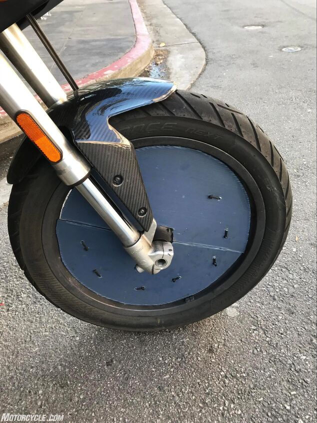 skidmarks touring on an electric moto, Wheel covers bump Brian s range 3 5 and are made out of plastic and zip ties Mooneyes the famous custom shop is interested in making a cool set of covers for him