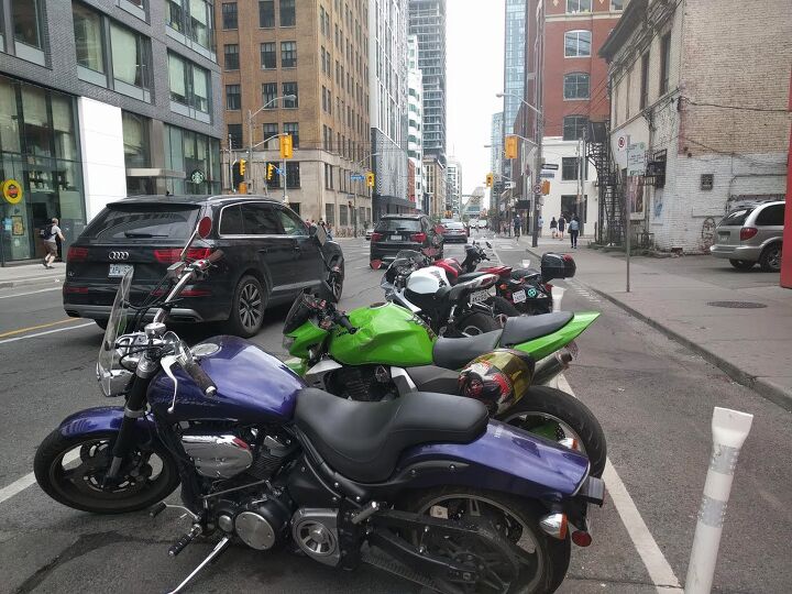 toronto to consider allowing lane sharing, A row of bikes parked across the street from the Toronto office of MO s parent company VerticalScope One of the proposed lane filtering streets runs through that intersection in the background