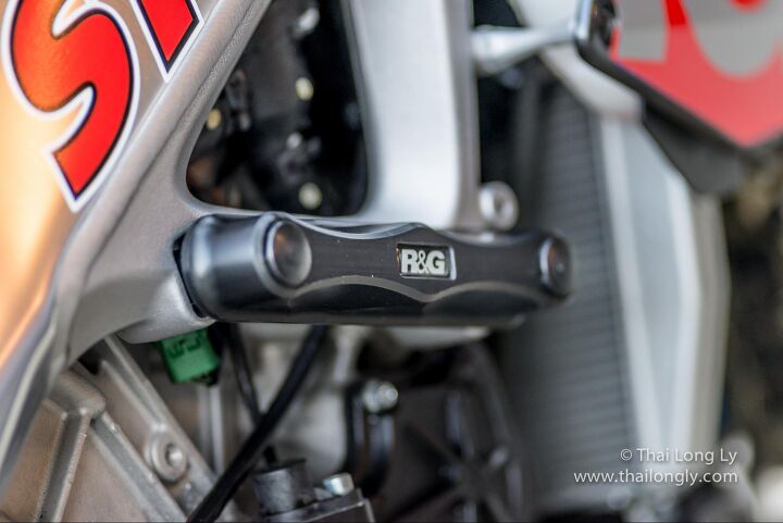 an owner s perspective aprilia tuono upgrades pt 2, R G frame sliders Excellent with a crisp IPA for a refreshing afternoon hang with friends