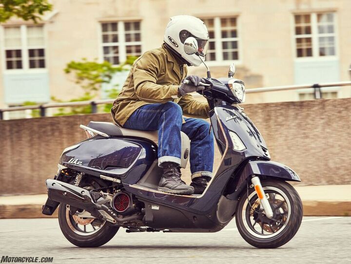 scooter versus motorcycle pros and cons, The Kymco Like 150i ABS a product that clearly takes aim at Vespa s Primavera and Sprint 150 offers similar performance safety and style for like 2 600