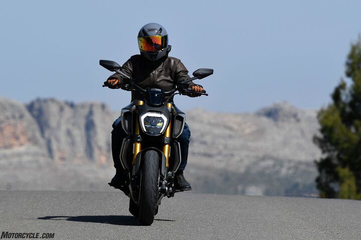 2019 ducati diavel 1260s review first ride, The redesigned bike presents a narrow aggressive front end aided by moving the radiator to the front of the bike Note the omega shaped LED running light as Ducati is very proud of it Be nice