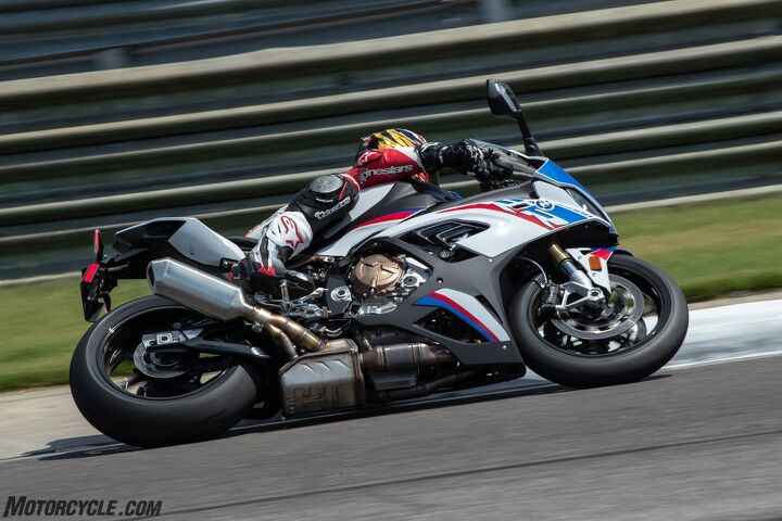 2020 bmw s1000rr review first ride, When fully cranked over the RR isn t quite as razor sharp as the gold standard Aprilia RSV4 but what you re probably staring at here is the huge underbelly exhaust canister