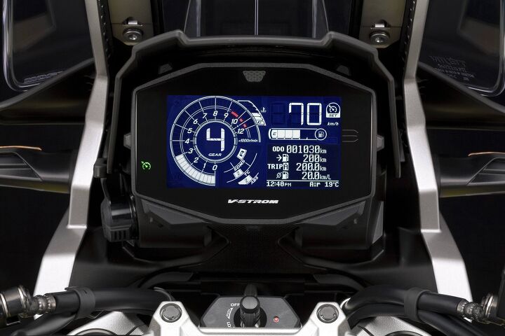 2020 suzuki v strom 1050xt review first ride, So it s not a TFT the new cluster is still big and easy to read and you re going to mount your phone above it anyway The gear position indicator right in the middle is easy to spot the computer gives you real time fuel consumption average fuel consumption range fuel level indicator engine coolant temperature ambient air temperature a clock voltage meter service reminder SDMS mode traction control mode ABS mode cruise control indicator hill hold indicator freeze indicator light turn signal traction control indicator light ABS indicator yada yada yada