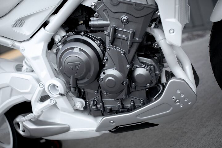 new triumph trident roadster coming for 2021, The Trident prototype s engine covers resemble those of the 675cc version of the Street Triple The more recent 765cc version has a shorter crankcase cover