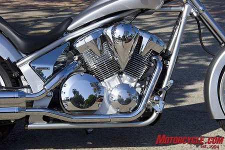 church of mo 2010 honda fury review, A new fuel injection system resides between the faux air cooled cylinders Popping off the chromed plastic panel behind the rear cylinder unveils the shock s adjustment knobs