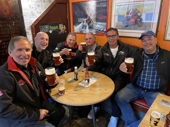 out and about at the isle of man tt 2022 part 1, The Rover s Return Pub is brimming with motorbike history fine conversation and delightful Bushy s Manx Bitter
