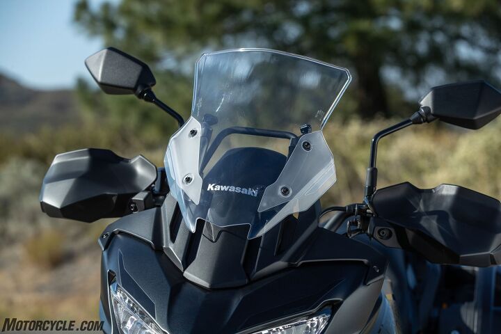 2022 kawasaki versys 650 lt review first ride, At its highest setting you can see the windscreen s railing underneath and get an idea how much lower it will go