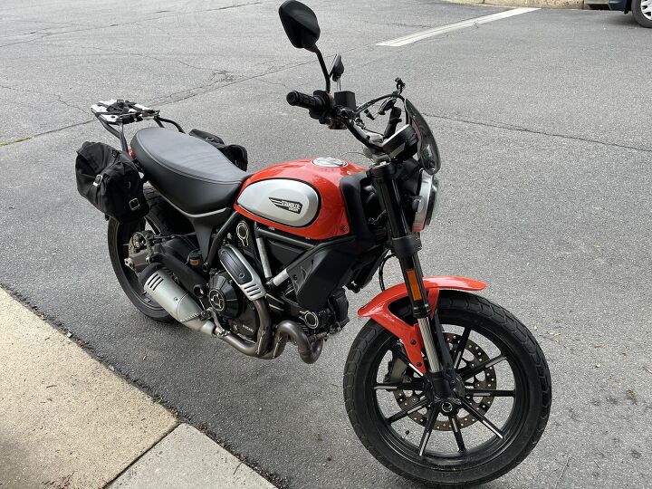 ducati scrambler less than a year old with factory and additional 5 yr warranty and